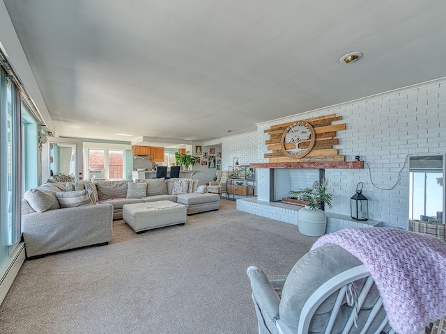 living room featuring light carpet, a healthy amount of sunlight, a brick fireplace, and brick wall