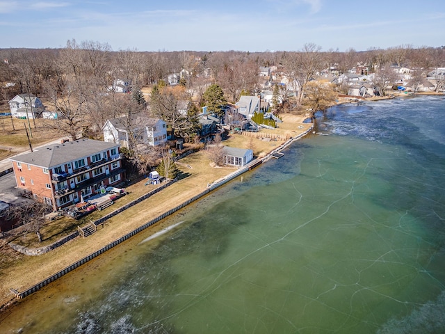 birds eye view of property with a residential view and a water view