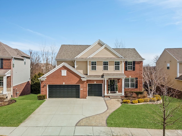 view of front of property featuring a front lawn, concrete driveway, brick siding, and roof with shingles