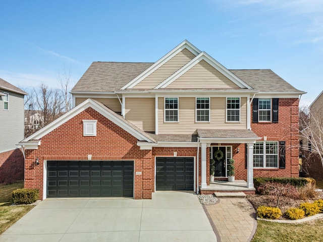 traditional-style home with concrete driveway, brick siding, and a shingled roof