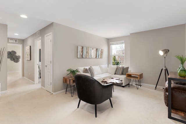 living area featuring recessed lighting, light colored carpet, visible vents, and baseboards