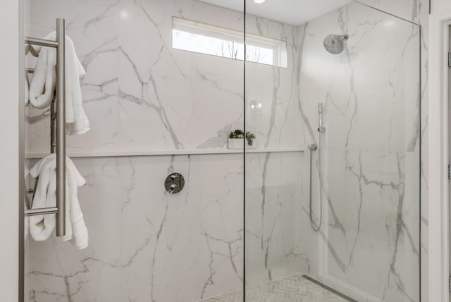 full bath featuring a marble finish shower