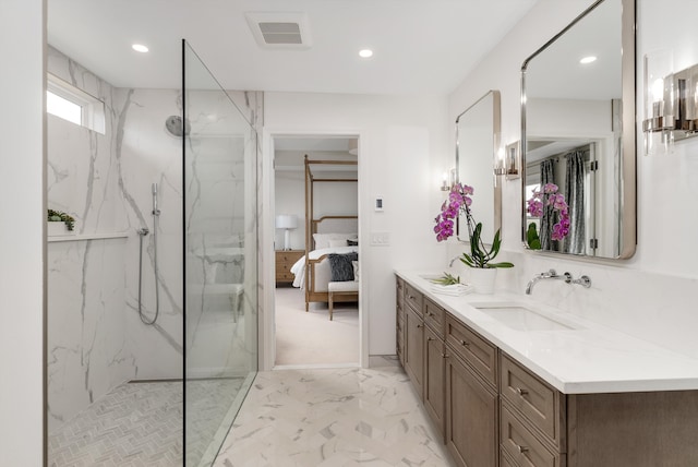 ensuite bathroom featuring a marble finish shower, visible vents, ensuite bathroom, marble finish floor, and a sink