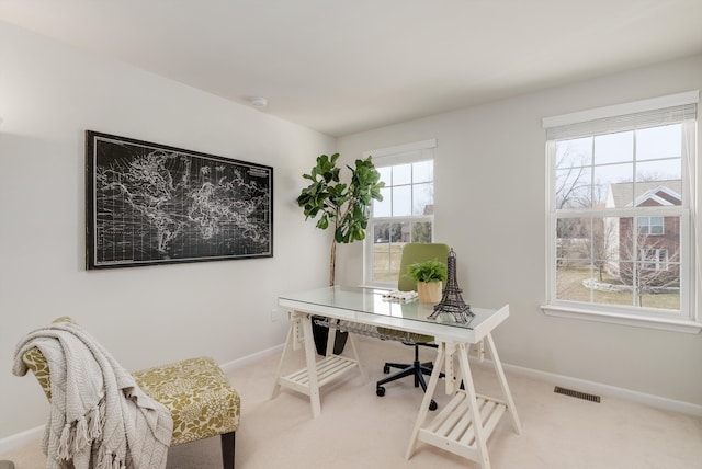 office space featuring carpet, visible vents, and baseboards