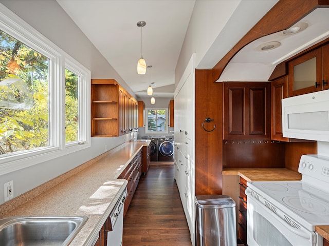 kitchen featuring white appliances, light countertops, lofted ceiling, and separate washer and dryer