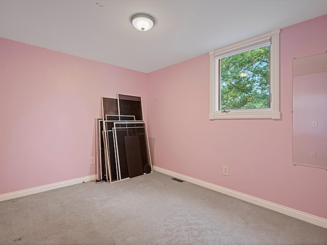 unfurnished bedroom with visible vents, baseboards, and carpet flooring