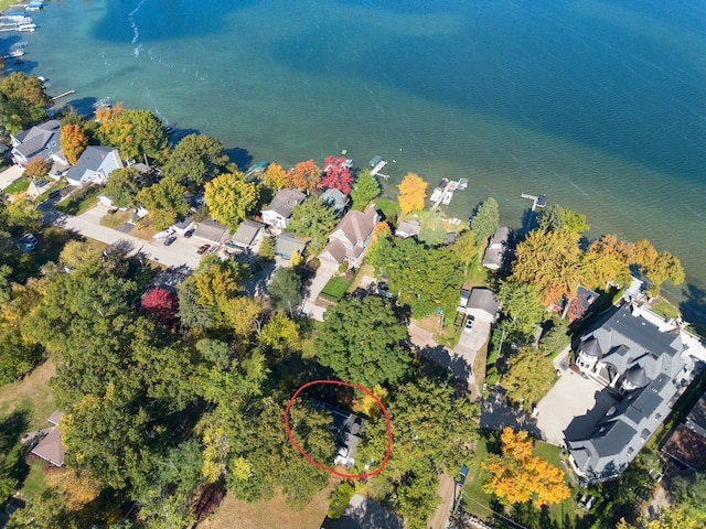 drone / aerial view with a residential view and a water view