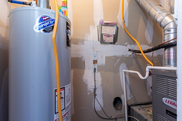 utility room featuring water heater