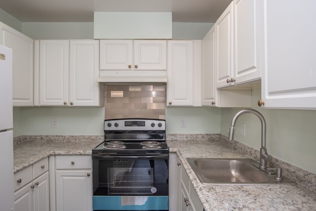 kitchen with a sink, electric range, under cabinet range hood, and white cabinetry