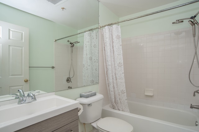 full bath featuring toilet, vanity, and shower / bath combo