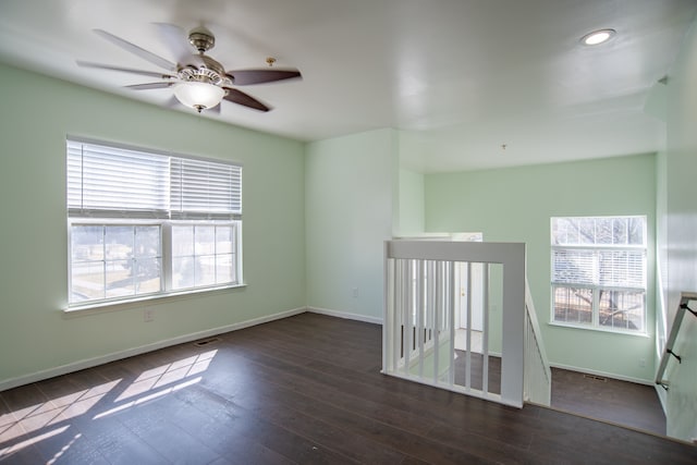 empty room featuring recessed lighting, visible vents, baseboards, and wood finished floors