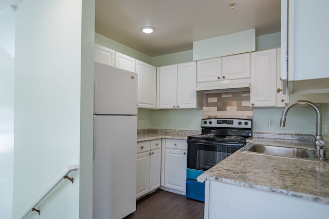 kitchen featuring freestanding refrigerator, a sink, white cabinets, electric stove, and under cabinet range hood