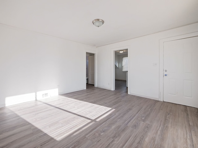 unfurnished room featuring wood finished floors