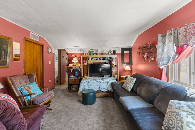 carpeted living room with visible vents and lofted ceiling