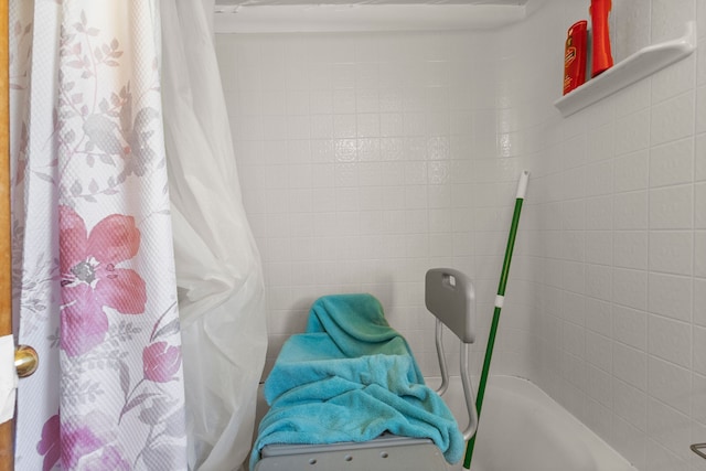 full bathroom with a shower with curtain and a washtub