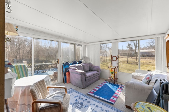 sunroom featuring lofted ceiling