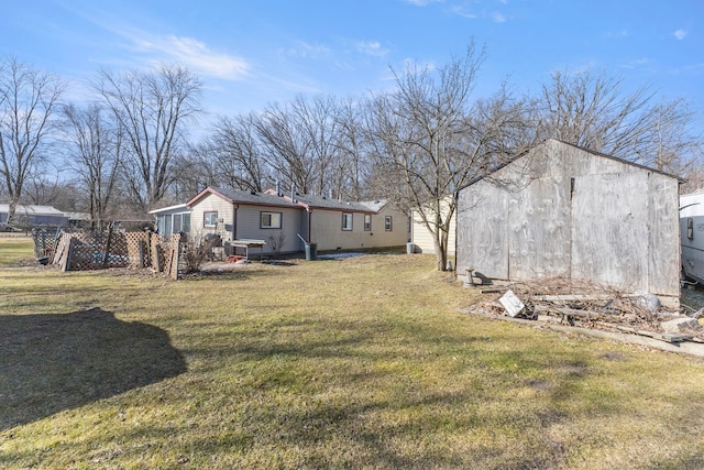 view of yard with an outdoor structure and fence