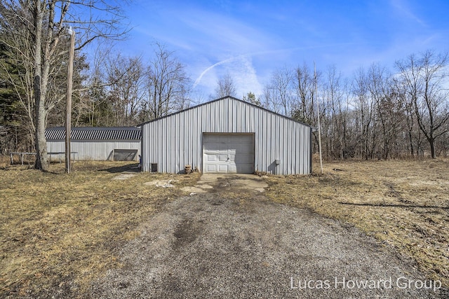 view of outbuilding featuring an outbuilding and driveway