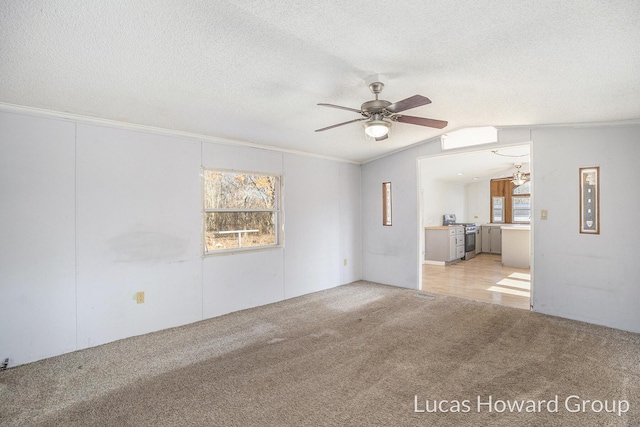 unfurnished living room featuring light carpet, a textured ceiling, a ceiling fan, and vaulted ceiling