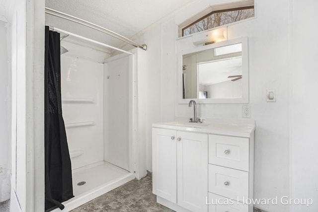 bathroom with vanity and a stall shower