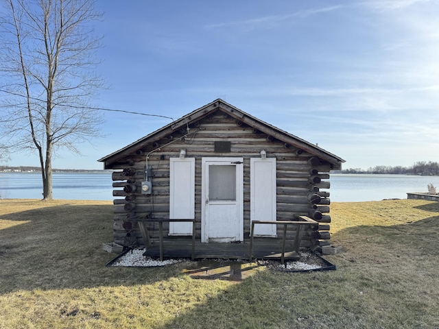 view of outdoor structure with an outbuilding and a water view