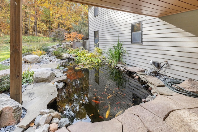 exterior space featuring a small pond