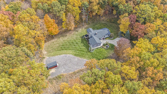 drone / aerial view featuring a view of trees