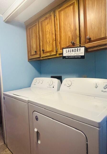 laundry area featuring cabinet space and washing machine and dryer