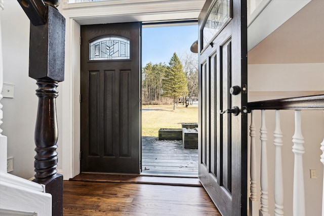 entryway with wood finished floors