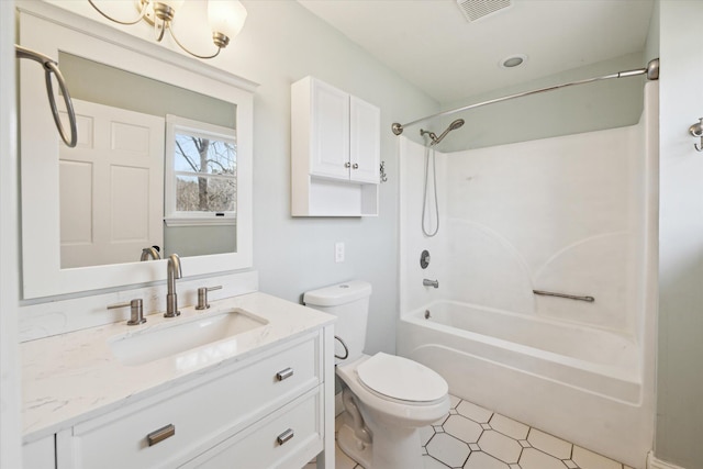 bathroom featuring visible vents, shower / washtub combination, toilet, and vanity