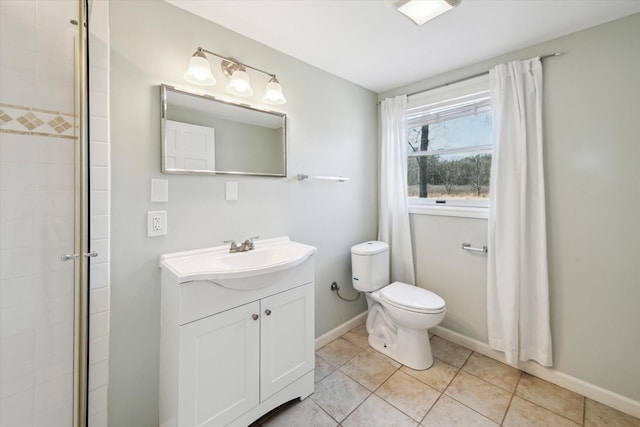 full bathroom with baseboards, toilet, a tile shower, tile patterned floors, and vanity