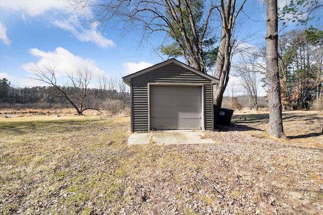 detached garage featuring driveway