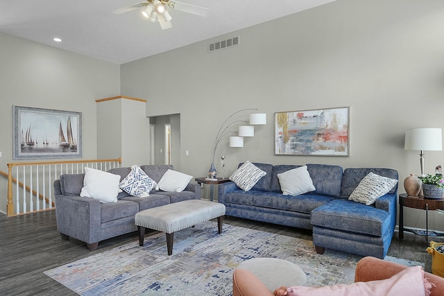 living area featuring ceiling fan, visible vents, and wood finished floors