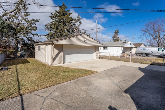 detached garage featuring fence