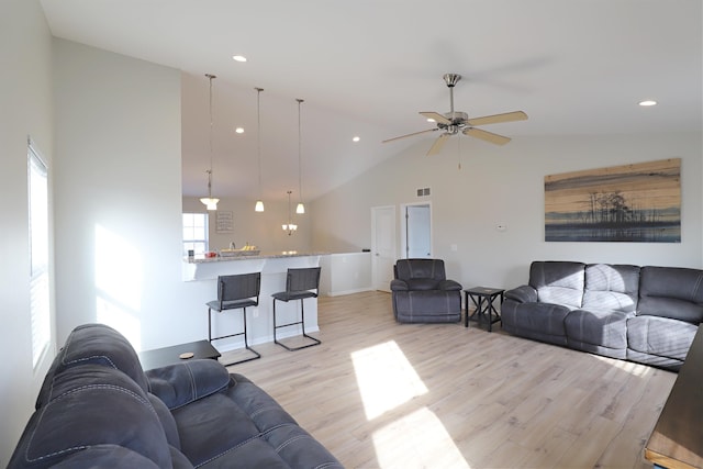 living area with visible vents, high vaulted ceiling, a ceiling fan, recessed lighting, and light wood finished floors