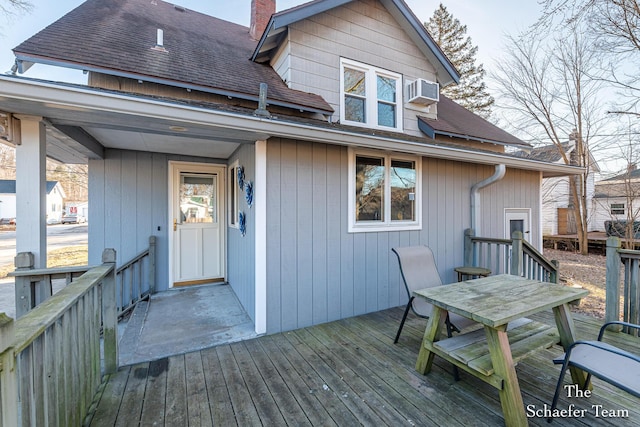 wooden terrace with a wall mounted AC