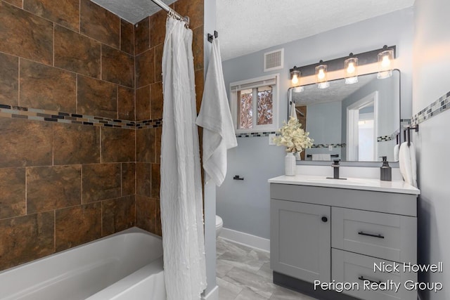 full bath featuring toilet, visible vents, marble finish floor, and a textured ceiling