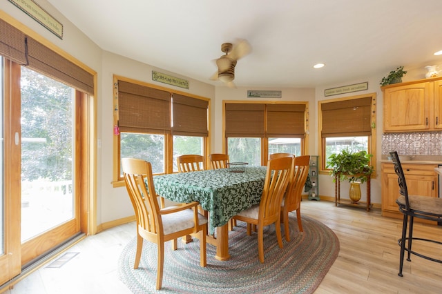15797 Hillside Dr, Vandalia, MI 49095 - dining space featuring light wood-style flooring, baseboards, visible vents, and a wealth of natural light