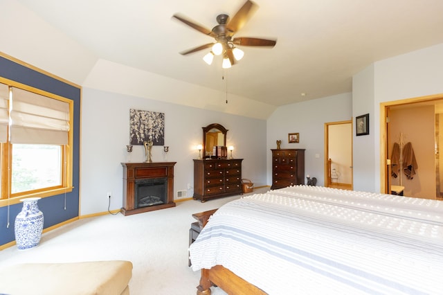 15797 Hillside Dr, Vandalia, MI 49095 - bedroom with light carpet, a fireplace, baseboards, ceiling fan, and vaulted ceiling