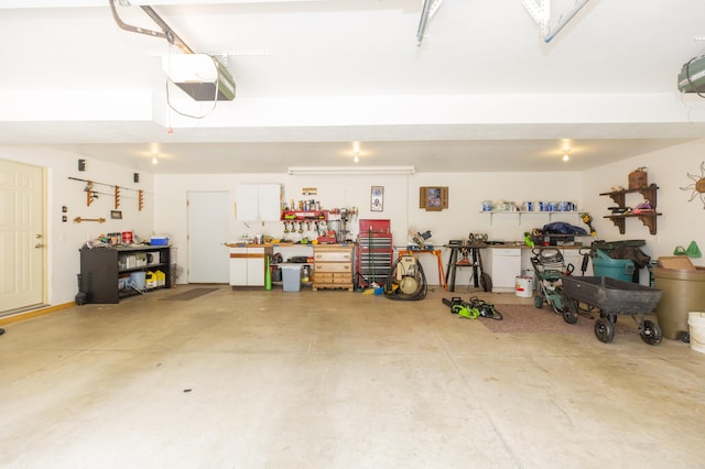 15797 Hillside Dr, Vandalia, MI 49095 - garage featuring a workshop area and a garage door opener