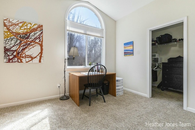 home office featuring carpet, lofted ceiling, and baseboards