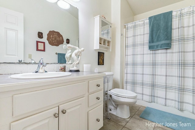 full bathroom featuring a shower with shower curtain, toilet, vanity, and tile patterned flooring