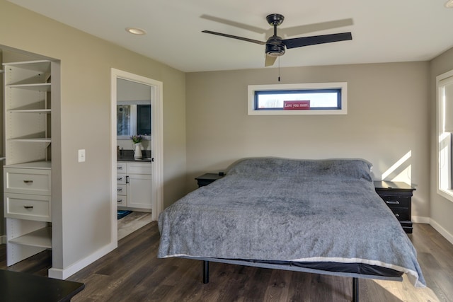 bedroom with baseboards, a ceiling fan, and dark wood-style flooring