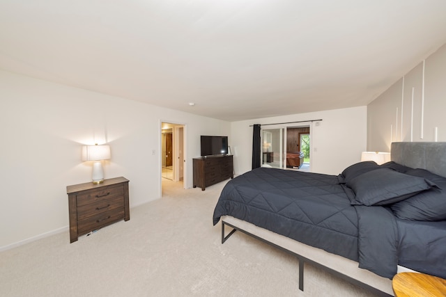 bedroom featuring access to outside, light colored carpet, and baseboards