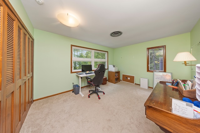 office space with visible vents, baseboards, and carpet flooring