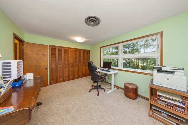 carpeted office with visible vents and baseboards