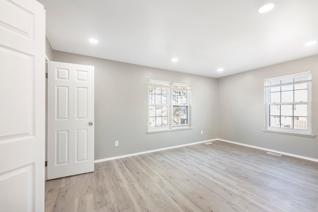 unfurnished room featuring light wood-style flooring, recessed lighting, and a healthy amount of sunlight