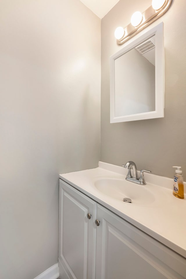 bathroom featuring vanity and visible vents