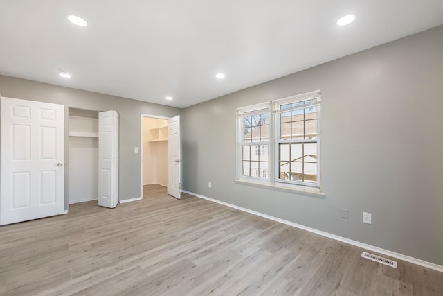 unfurnished bedroom with recessed lighting, visible vents, and light wood-style flooring