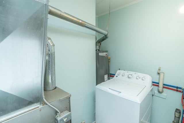 clothes washing area with gas water heater, washer / clothes dryer, and laundry area